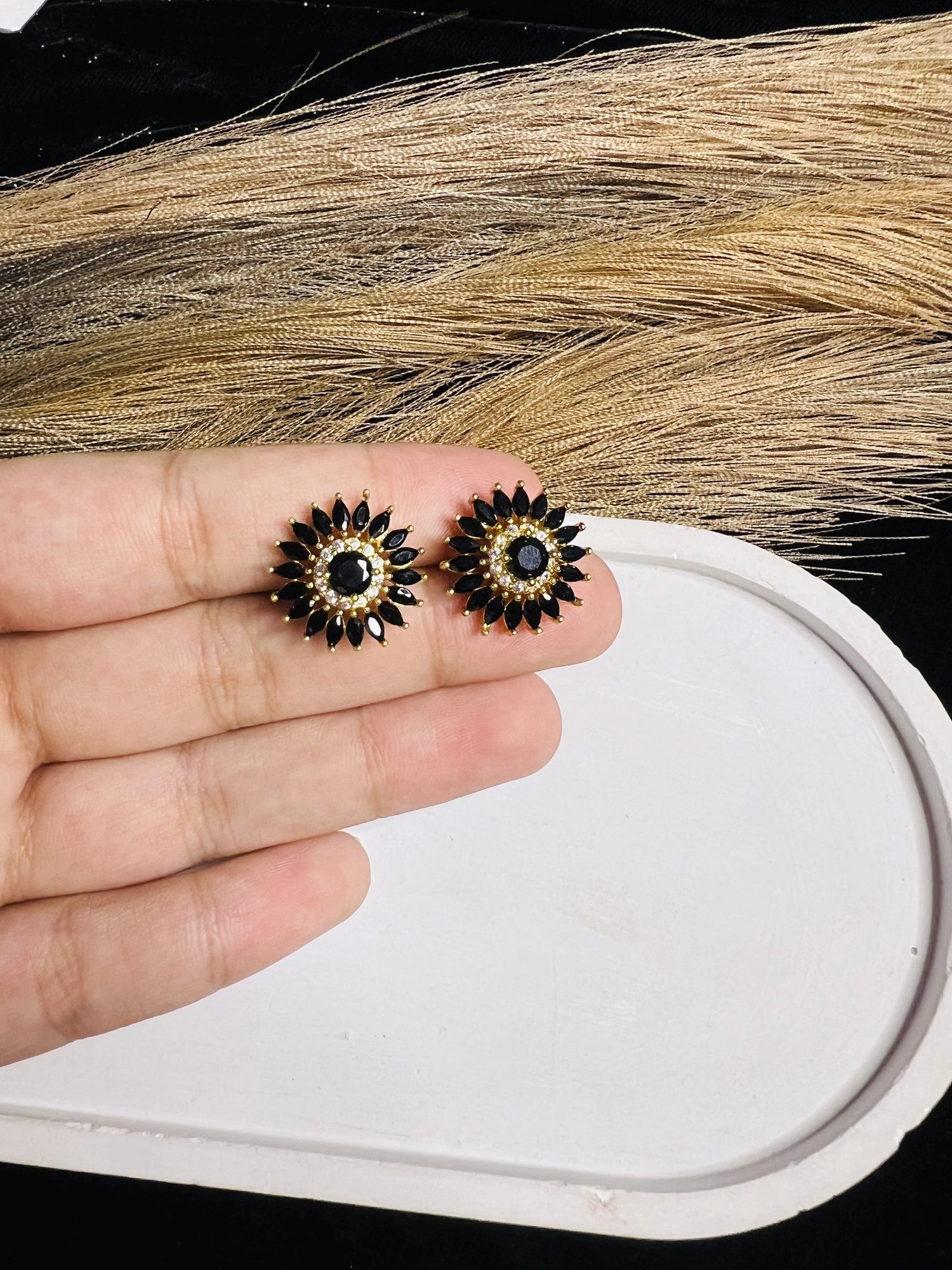 Black floral studs